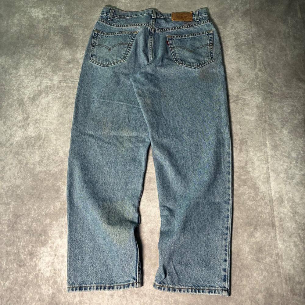 Vintage Levis 550 Relaxed Fit Tapered Leg Jeans Light Wash Blue 36x29 Mens 90s